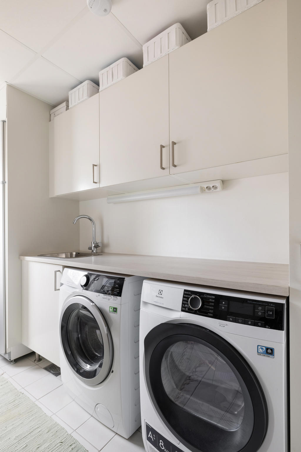 Tvättstuga intill köket