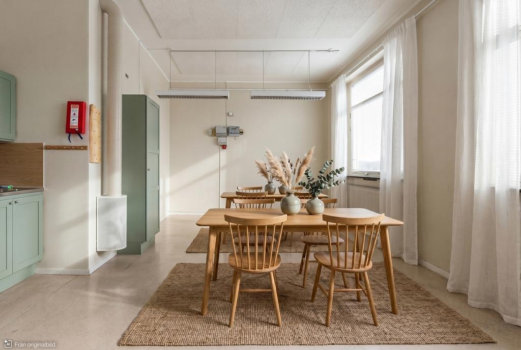 Visualisering: Förslag på en gemensam matplats/kök med plats för flera att laga mat samtidigt, vilket främjar gemenskapen i ett co-living-koncept.
