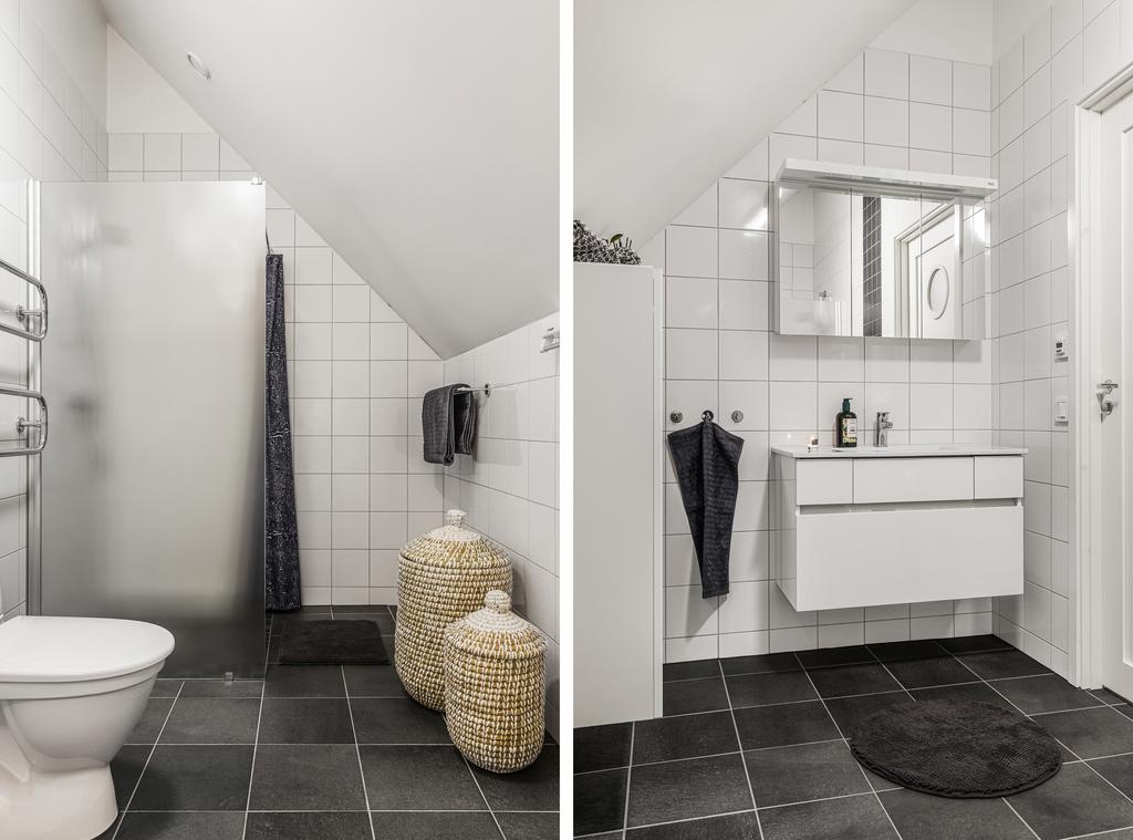 Övervåningens badrum är ljust och fräscht och även här går kakel och klinker i tidlös färgsättning 