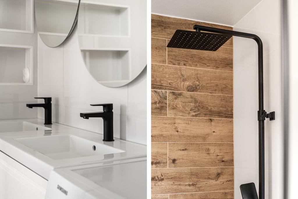 Duschrummet med dubbla tvättställ och vattenfallsdusch. Stilrena detaljer som svarta blandare samt dusch.