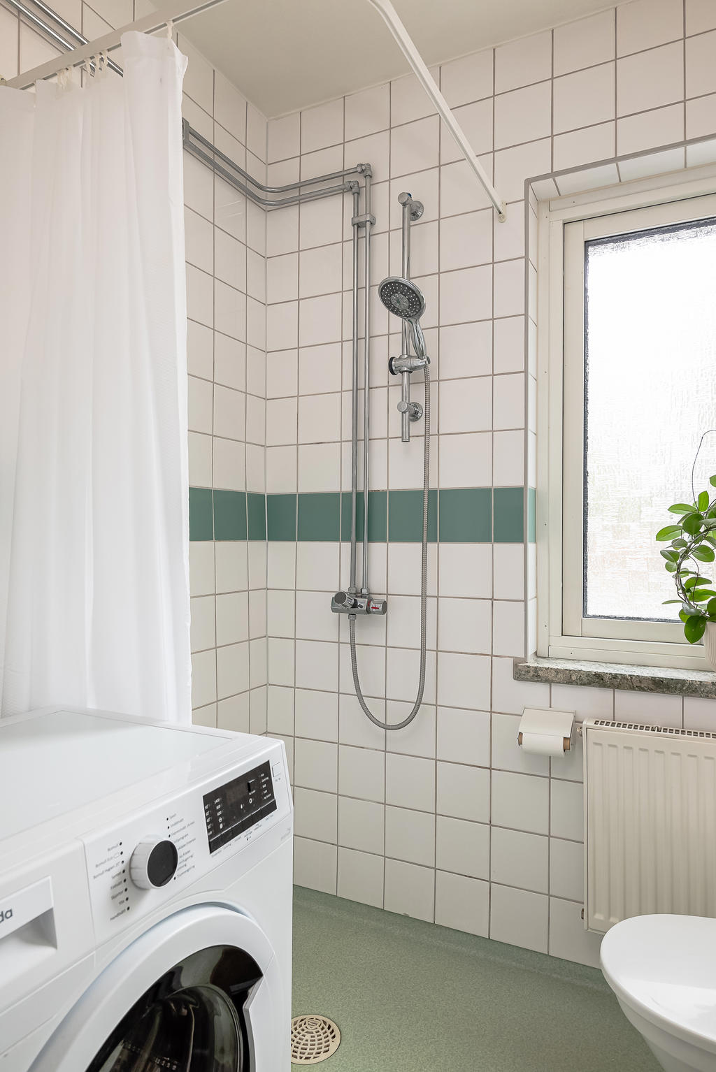 Duschhörna och tvättmaskin