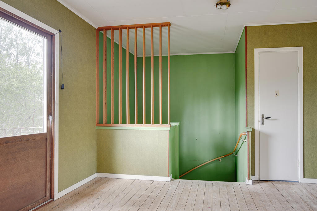 Hall ovanvåning med balkong