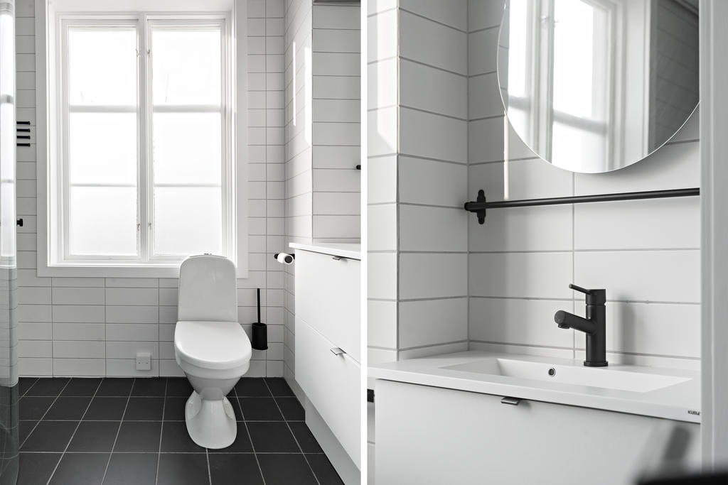 Helkaklat badrum med spotlights i taket och golvvärme. 