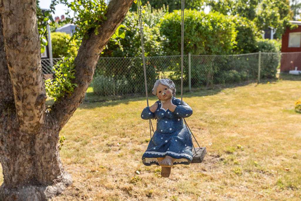 Liten trädgårdsmaskot