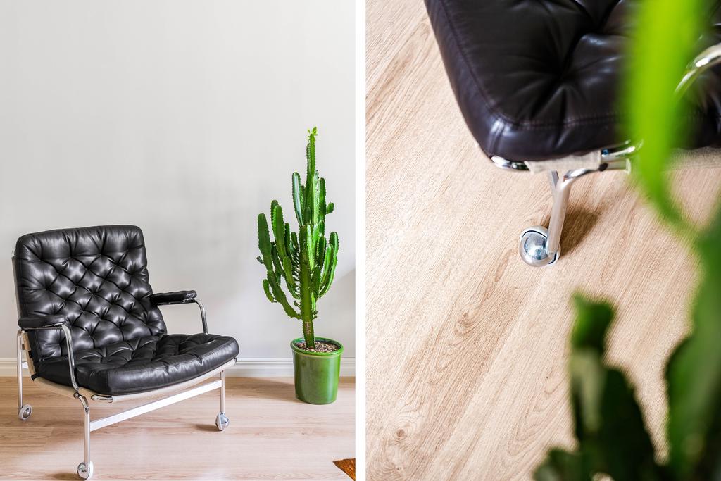 Ljust laminatgolv genomgående i vardagsrum, hall och kök
