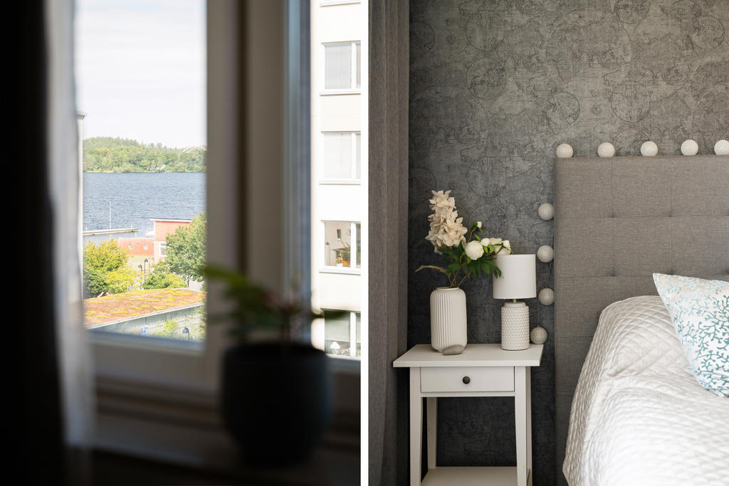 Harmoniskt sovrum med sjöutsikt.