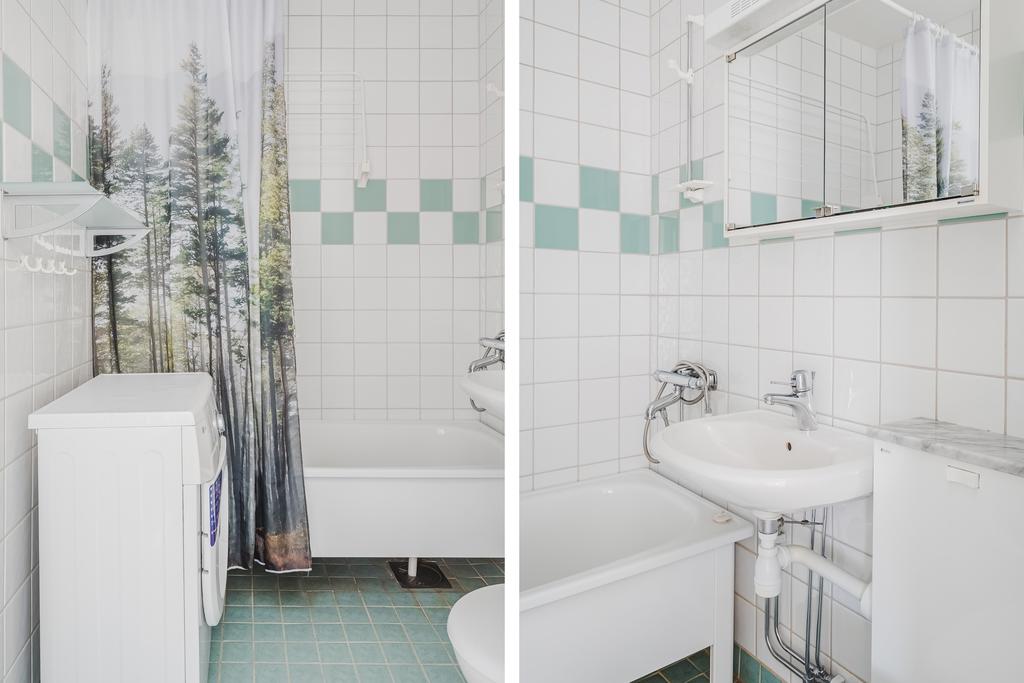 Helkaklat badrum med tvättmaskin