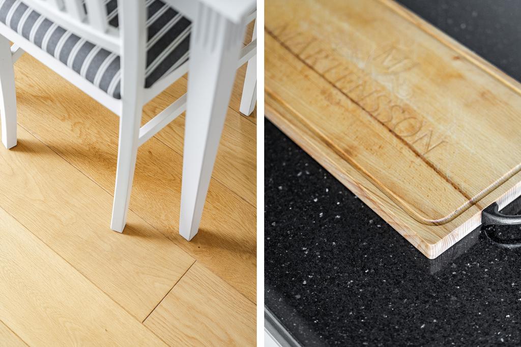 Lyxiga materialval som enstavig ekparkett och bänkskiva i sten 