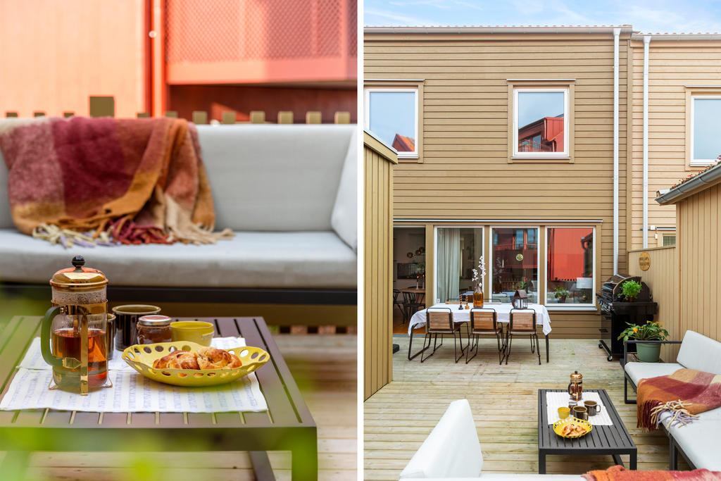 Bostadens baksida utrustad med altan och förråd