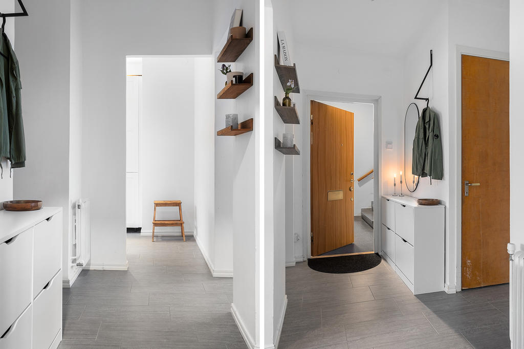 Ljus hall med praktiskt klinkergolv och fräscha vita väggar.