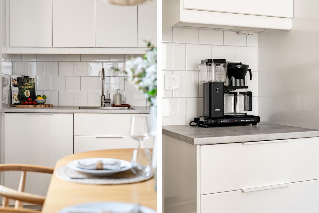 Bänkskiva i grå laminat och kaklat stänkskydd