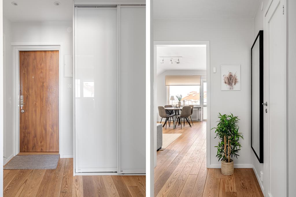 Funktionell hall med skjutdörrsgarderober