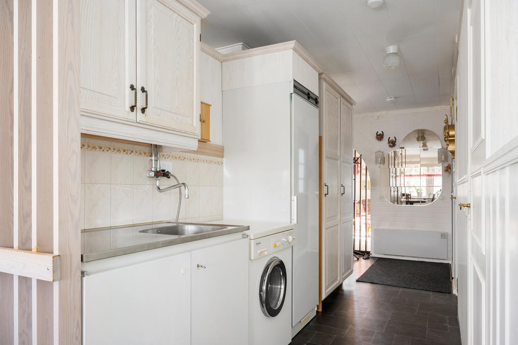 Tvättdel på baksidan av köket