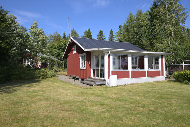 Storstugan med inglasad altan vid entren
